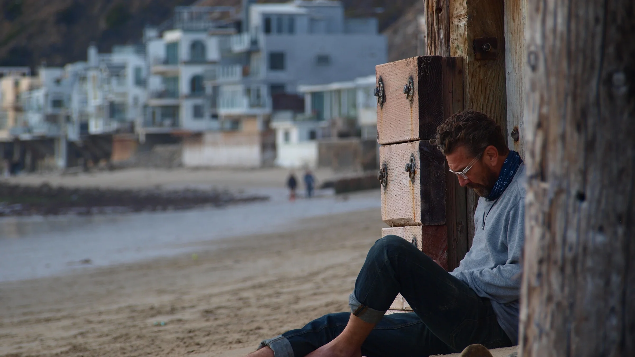 Man Writing in a Beach